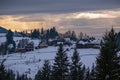 Small and quiet alpine village and winter sunrise snowy mountains around, Voronenko, Carpathian, Ukraine Royalty Free Stock Photo