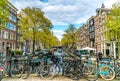 Small quiet canal with bikes on bridge in front in the Center of Amsterdam Royalty Free Stock Photo