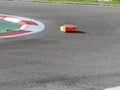 Small radio controlled model car on the track . Miniature remote controlled sport racing cars hobby