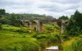 Small railway bridge over small river near Manjakandriana, Madagascar, green grass and trees around. There is only small number of Royalty Free Stock Photo