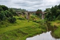 Small railway bridge over small river near Manjakandriana, Madagascar, green grass and trees around. There is only small number of Royalty Free Stock Photo