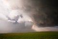 Small Rainbow & Storm Clouds Royalty Free Stock Photo