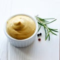 Pot of mustard with a sprig of rosemary Royalty Free Stock Photo