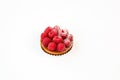 Small raspberry cake on a white background