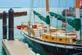 Small recreational boat is docked in the tranquil waters of a harbor Royalty Free Stock Photo
