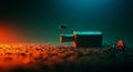 A small, rectangular robot lies on a textured surface scattered with pebbles. It