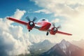 A small red airplane soaring through the sky above a majestic mountain range. Perfect for travel and adventure themes Royalty Free Stock Photo