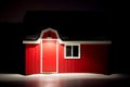 Small red barn with white trim in icy snow Royalty Free Stock Photo