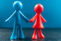 Small red and blue plastic toy copleFigurines of an couple Royalty Free Stock Photo