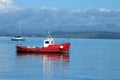 Small red boat anchored in Morecambe Bay, Morecambe Royalty Free Stock Photo