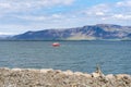 Small red boat in Faxafloi bay in Reykjavik, Iceland Royalty Free Stock Photo