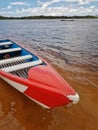 Small red boat moored by the river. Royalty Free Stock Photo