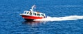 Small Red Boat Speeding Across the Mediterranean sea Royalty Free Stock Photo