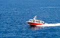 Small Red Boat Speeding Across the Mediterranean sea Royalty Free Stock Photo