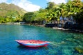 Small red boat on turquoise water Royalty Free Stock Photo