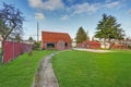 Small red brick home on a sunny day Royalty Free Stock Photo