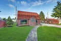 Small red brick home on a sunny day Royalty Free Stock Photo