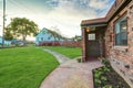 Small red brick home on a sunny day Royalty Free Stock Photo