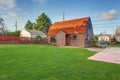 Small red brick home on a sunny day Royalty Free Stock Photo