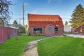 Small red brick home on a sunny day Royalty Free Stock Photo