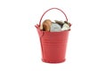 Small red bucket full of money on white background Royalty Free Stock Photo