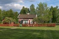 Small red cabin with red picket fence in Fagersta, Sweden Royalty Free Stock Photo