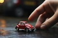 A small red car in the palm of your hand. Generative AI Royalty Free Stock Photo