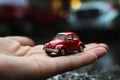 A small red car in the palm of your hand. Generative AI Royalty Free Stock Photo