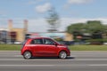 A small red car. Renault Twingo is driving on the road. Motion blur. Riga, Latvia - 28 Jun 2021 Royalty Free Stock Photo