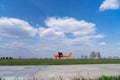 Small red charter airplane waiting on a green field to take off Royalty Free Stock Photo