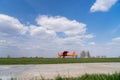 Small red charter airplane waiting on a green field to take off Royalty Free Stock Photo