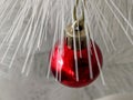 Small red Christmas ball decoration on the Chrismas tree Royalty Free Stock Photo