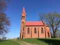 Red church on a hill in Strzepowo Poland Royalty Free Stock Photo