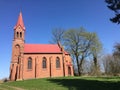 Red church on a hill in Strzepowo Poland Royalty Free Stock Photo