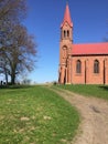 Red church on a hill in Strzepowo Poland Royalty Free Stock Photo
