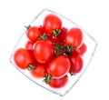 Small red cocktail tomatoes in glass bowl