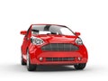 Small Red Compact Car - Front Headlight View