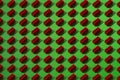 Small red details pattern from constructor on a green background