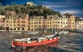 Small red fishing boat in Portofino harbor