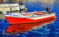 Small red fishing boat on the sea in the port Royalty Free Stock Photo