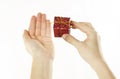 Red gift in gentle hands of a young girl, on a white isolated background Royalty Free Stock Photo