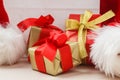 Small red and golden boxes with gifts tied bows Royalty Free Stock Photo