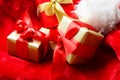 Small red and golden boxes with gifts tied bows Royalty Free Stock Photo