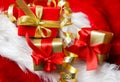 Small red and golden boxes with gifts tied bows Royalty Free Stock Photo