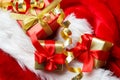 Small red and golden boxes with gifts tied bows Royalty Free Stock Photo