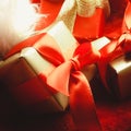 Small red and golden boxes with gifts tied bows Royalty Free Stock Photo