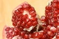 Small red grains. Chopped fruit. Pomegranate slices Royalty Free Stock Photo