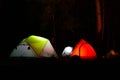 Small red and green tents in the dark forest in Turkey, Lycian way