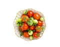Small red and green tomatoes in white bowl Royalty Free Stock Photo