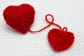 A Small Red Handmade Crochet Heart And Red Yarn Ball Like A Heart On The White Crochet Background. A Heart Made Of Wool Yarn. Roma